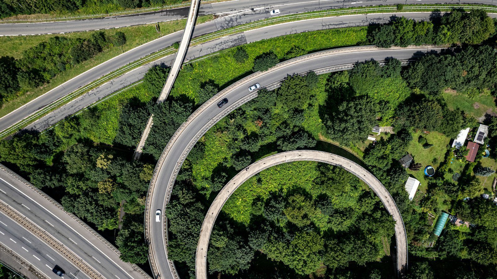 Aerial view of a highway interchange where several roads converge into one flow